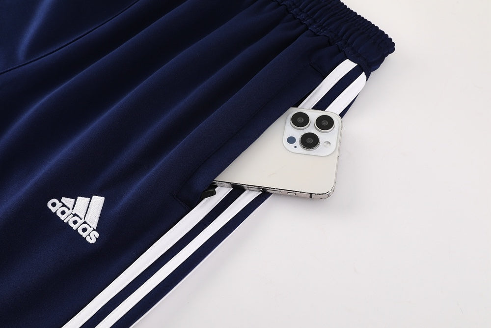 Tuta Sport blu riga bianca